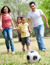 Family playing soccer